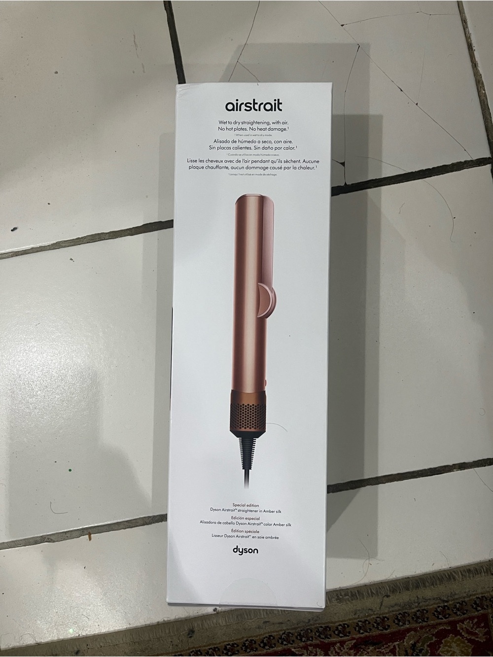New NEVER USED or opened Dyson Airstrait Hair Straightener in Rose Gold.
